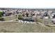 Aerial view of a neighborhood playground with modern equipment and picnic tables provides recreation for families and children at 9758 Laredo St # 22D, Commerce City, CO 80022