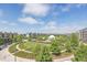 Panoramic view of the community park with walking paths, green spaces, and mature trees at 2958 Syracuse St # 403, Denver, CO 80238