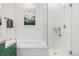 Clean, well-lit bathroom showcasing a soaking tub and separate glass-enclosed shower at 2958 Syracuse St # 403, Denver, CO 80238
