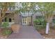 Building entrance featuring a modern awning and brick exterior at 2958 Syracuse St # 403, Denver, CO 80238