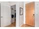 Hallway features an open closet space and a wooden front door at 2958 Syracuse St # 403, Denver, CO 80238