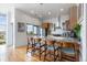 Modern kitchen with stainless steel appliances, granite countertops, and a breakfast bar with seating at 2958 Syracuse St # 403, Denver, CO 80238