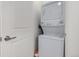 Stacked white washer and dryer provides space-saving convenience at 2958 Syracuse St # 403, Denver, CO 80238