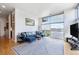 Inviting living room featuring a sectional sofa and large windows with great views at 2958 Syracuse St # 403, Denver, CO 80238