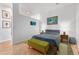 Cozy bedroom features stylish decor, wood floors, and soft, natural lighting at 2958 Syracuse St # 403, Denver, CO 80238
