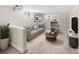 Cozy living room features contemporary furniture, neutral colors, and bright lighting at 2676 S Lincoln St, Denver, CO 80210