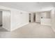Unfinished basement features neutral carpet, recessed lighting and access to additional rooms and stairs at 2676 S Lincoln St, Denver, CO 80210