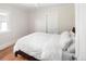 Cozy bedroom with hardwood floors, natural light, and a comfortable bed at 2676 S Lincoln St, Denver, CO 80210