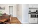 Cozy dining room with hardwood floors, adjacent to the modern kitchen at 2676 S Lincoln St, Denver, CO 80210