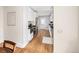 Bright kitchen featuring stainless appliances, white cabinets, and hardwood floors at 2676 S Lincoln St, Denver, CO 80210
