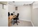 Cozy finished basement office space with carpet flooring, natural light and a wood desk at 2676 S Lincoln St, Denver, CO 80210