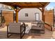 Relax on the covered patio with outdoor seating, privacy screens, and string lights at 2676 S Lincoln St, Denver, CO 80210