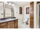 Bathroom features a large vanity, medicine cabinet, and enclosed shower and toilet at 20942 E Hampden Pl, Aurora, CO 80013