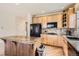 Modern kitchen with stainless steel appliances, granite countertops, and a central island at 20942 E Hampden Pl, Aurora, CO 80013