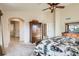 Spacious main bedroom with vaulted ceilings, ceiling fan, and en suite bathroom with walk-in closet at 20942 E Hampden Pl, Aurora, CO 80013