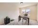 Well lit office area with large window, plush carpet, and desk with chair for home office use at 20942 E Hampden Pl, Aurora, CO 80013