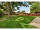 Expansive backyard features lush green grass and a privacy fence at 1840 E 84Th Ave, Denver, CO 80229
