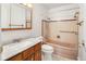 Retro bathroom features a marble vanity, toilet and shower and bathtub at 1840 E 84Th Ave, Denver, CO 80229