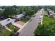 Aerial view featuring the home's manicured front lawn and neighborhood street at 1840 E 84Th Ave, Denver, CO 80229