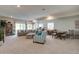 Spacious finished basement featuring a comfortable seating area, large sectional, and a table at 527 Felicity Loop, Castle Rock, CO 80109