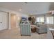 Finished basement showcasing a comfortable seating area and a large TV with sliding doors at 527 Felicity Loop, Castle Rock, CO 80109