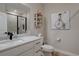 Modern bathroom featuring a stylish vanity with marble countertops and an elegant glass-enclosed shower at 527 Felicity Loop, Castle Rock, CO 80109