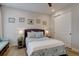 Comfortable bedroom with queen bed, soft patterned bedding, and stylish decor on walls at 527 Felicity Loop, Castle Rock, CO 80109