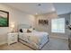 Cozy bedroom with neutral walls, carpet, and a plush bed, complemented by natural light from the window at 527 Felicity Loop, Castle Rock, CO 80109