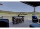 Outdoor deck area with table and chairs, perfect for enjoying scenic views at 527 Felicity Loop, Castle Rock, CO 80109