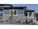 Charming home exterior with stone accents and well-maintained landscaping, providing curb appeal and beauty at 527 Felicity Loop, Castle Rock, CO 80109