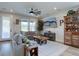 Comfortable living room with a large gray sofa, stylish coffee table, ceiling fan, and decor at 527 Felicity Loop, Castle Rock, CO 80109