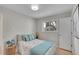 Simple bedroom with a double bed and window at 2459 S Perry St, Denver, CO 80219