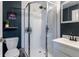 Modern bathroom features a glass enclosed shower with subway tile and a sleek vanity with a dark faucet at 2829 W 53Rd Ave # 104, Denver, CO 80221