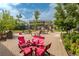 A common area with tables and chairs between the townhomes at 2829 W 53Rd Ave # 104, Denver, CO 80221