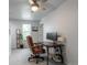 Bright office space features a classic leather chair, a wooden desk, and ample natural light at 2829 W 53Rd Ave # 104, Denver, CO 80221