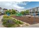 Colorful playground with slide, swings, and climbing structure in a landscaped community at 2829 W 53Rd Ave # 104, Denver, CO 80221