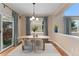 Dining area with lots of natural light and a sliding glass door to the backyard at 10294 Spotted Owl Ct, Highlands Ranch, CO 80129