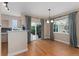 Dining area near the kitchen features natural light and a sliding glass door to the backyard at 10294 Spotted Owl Ct, Highlands Ranch, CO 80129