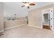Spacious carpeted hallway with an open view and overhead lighting at 10294 Spotted Owl Ct, Highlands Ranch, CO 80129