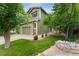 Exterior view of a two-story home with an attached garage and well-manicured front yard at 10294 Spotted Owl Ct, Highlands Ranch, CO 80129