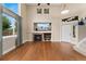 Bright living room with a fireplace, large windows, and an open floor plan at 10294 Spotted Owl Ct, Highlands Ranch, CO 80129