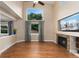Spacious living room with a fireplace and lots of natural light at 10294 Spotted Owl Ct, Highlands Ranch, CO 80129