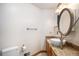 Bright bathroom featuring a granite countertop, vessel sink, and modern fixtures at 3285 Balsam St, Wheat Ridge, CO 80033