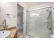 Clean bathroom featuring a glass shower door, modern shower head, and tiled floor at 3285 Balsam St, Wheat Ridge, CO 80033