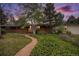 Charming brick home with a well-manicured lawn and a brick pathway leading to the entrance at 3285 Balsam St, Wheat Ridge, CO 80033