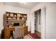 Efficient home office space with built-in shelving, desk, and additional closet storage at 3285 Balsam St, Wheat Ridge, CO 80033