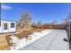 Landscaped backyard with a wooden fence at 16851 E Mansfield Cir, Aurora, CO 80013