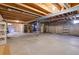 Unfinished basement with shelving for storage at 16851 E Mansfield Cir, Aurora, CO 80013