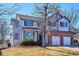 Charming two-story home with a brick-accented two-car garage and classic architectural details at 13434 W 62Nd Pl, Arvada, CO 80004