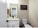 Stylish half-bathroom with a modern vanity, sleek fixtures, and minimalist decor at 5347 Osceola St, Denver, CO 80212